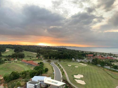 an aerial view of a golf course at sunset at Sea View Family Room at Nuvasa Bay Resort in Nongsa