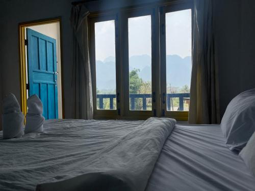 Ένα ή περισσότερα κρεβάτια σε δωμάτιο στο Blue Sunset Hostel
