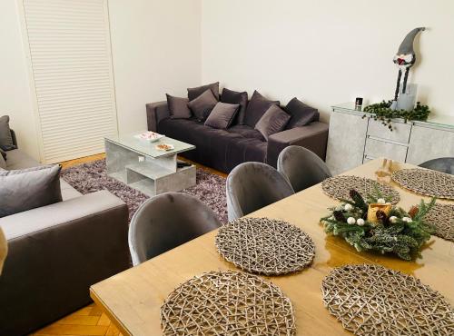 a living room with two tables and a couch at DELUXE Dom z sauną i jacuzzi w otoczeniu gór, lasu i jeziora in Łodygowice