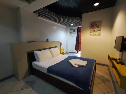 Balai Subik Hotelにあるベッド
