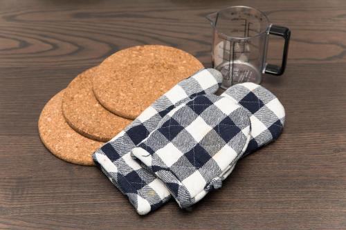 a plaid scarf is sitting on top of a table at ガジュマルの庭～itoman in Ō