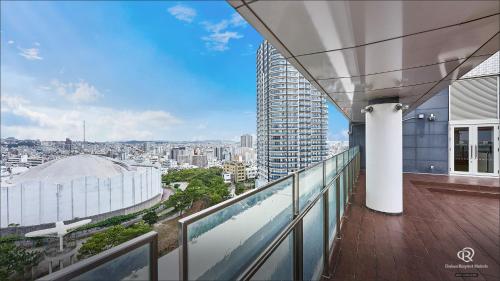 a balcony with a view of a city at Daiwa Roynet Hotel Naha Omoromachi in Naha