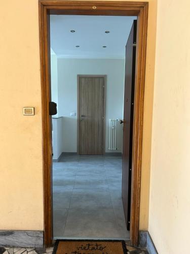 an open door to a hallway with a hallway leading into a room at Casa Franco in Turin