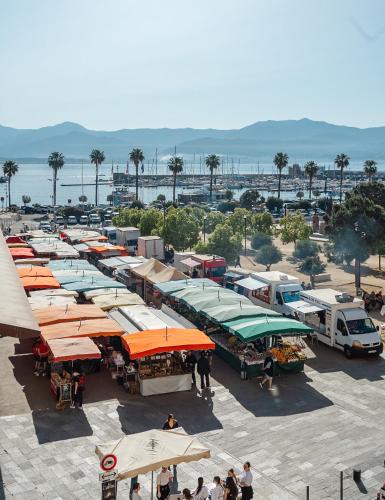 an aerial view of a parking lot with many tents at Hôtel Du Golfe in Ajaccio