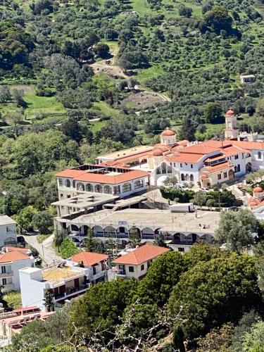 an aerial view of a building on a hill at Costas Inn in Spílion