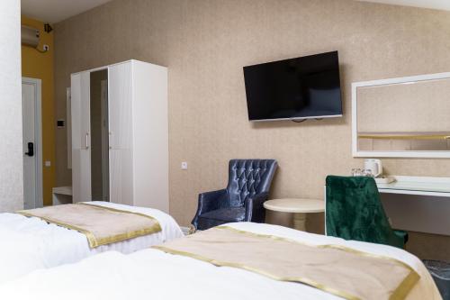 Кровать или кровати в номере AYNIY Hotel