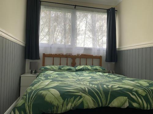 En eller flere senge i et værelse på 54 Belle Aire Hemsby