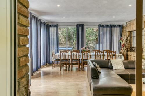 a living room with a couch and a table at Casa Nadia in Romanyá de la Selva