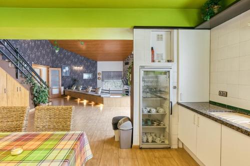 a kitchen with a refrigerator in a room at Casa Nadia in Romanyá de la Selva