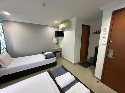 TV a/nebo společenská místnost v ubytování Maha Hotel