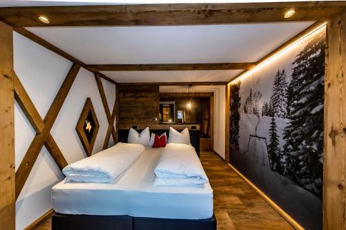 a bedroom with two beds in a room at Rifugio Crëp de Munt in Corvara in Badia