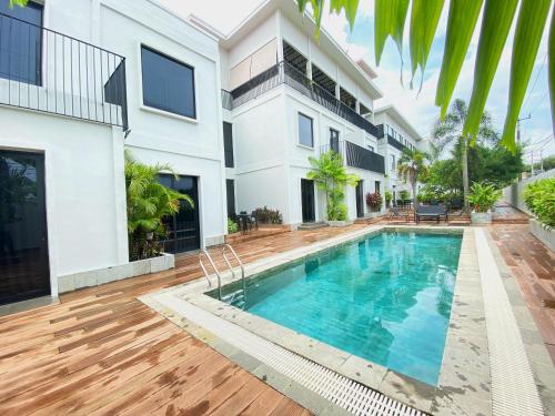 an image of a house with a swimming pool at ONYX HOTEL & VILLA in Tanjunguban