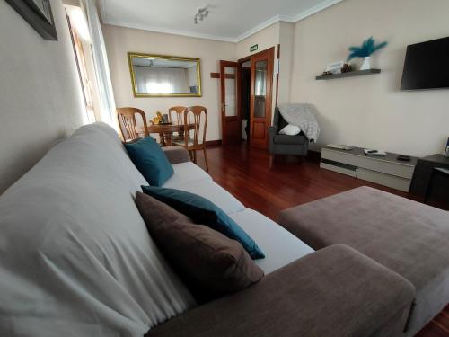 a living room with a couch and a table at Pedroenea Apartamento Elizondo in Elizondo