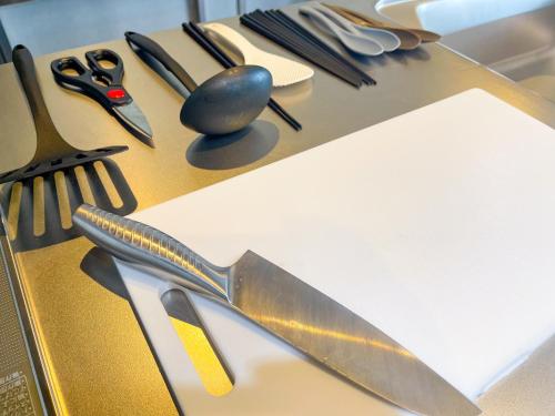 a table with scissors and other utensils on it at 忍野八海まで車で４分！ワンランク上のアウトドアライフ堪能できる【LongevityVillage】B in Minamitsuru