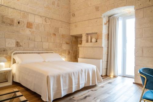 Postel nebo postele na pokoji v ubytování Innesto Rooms - Monopoli