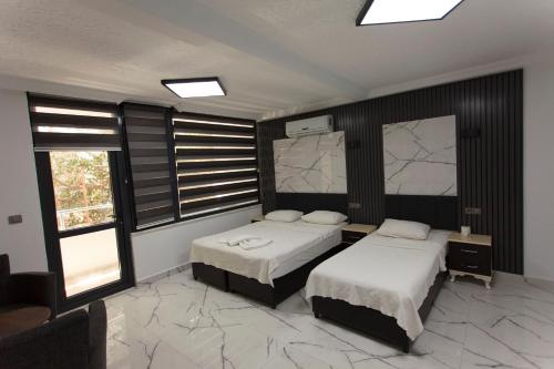 Katil atau katil-katil dalam bilik di Green Peace Hotel