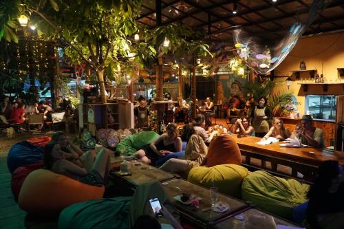 a group of people sitting on bean bags in a bar at SECRET GARDEN CAT BA in Cat Ba