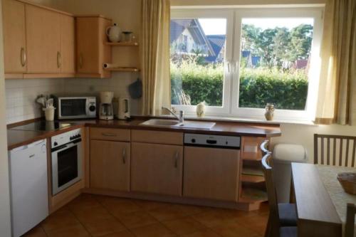 Kjøkken eller kjøkkenkrok på 30 EG - Gemuetliche Ferienwohnung direkt am See in Roebel Mueritz