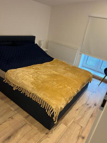 Un pat sau paturi într-o cameră la Diament