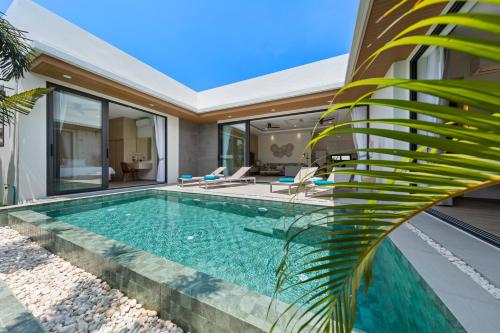 a swimming pool in the backyard of a house at Paradise Springs Samui Villas - PSS10 - Luxury 3BR in Bophut