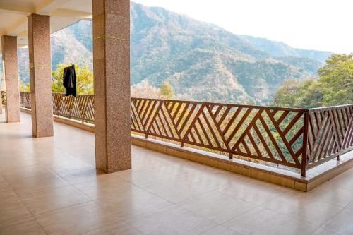 a balcony with a view of a mountain at Hotel Dream Catcher in Rishīkesh