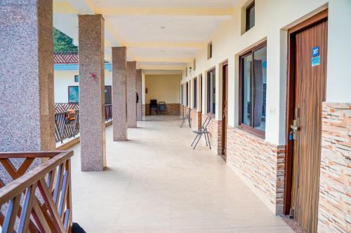 a corridor of a school building with a wooden door at Hotel Dream Catcher in Rishīkesh