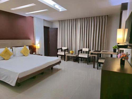 Ένα ή περισσότερα κρεβάτια σε δωμάτιο στο Hotel Daaysco Oley Allo