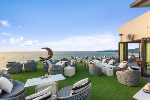 a restaurant with a view of the ocean at Cape Sienna Phuket Gourmet Hotel & Villas - SHA Extra Plus in Kamala Beach