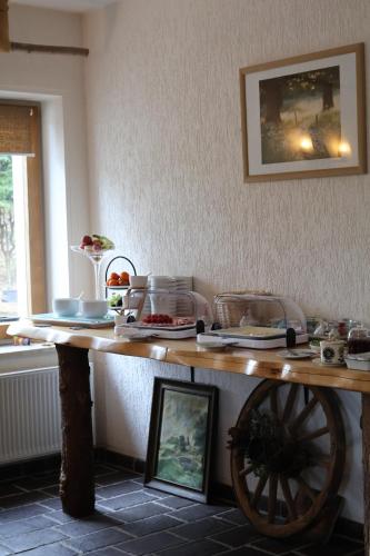 a wooden table with food on top of it at Hotel Carolaruh in Bad Elster