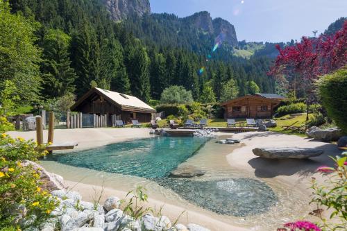 a swimming pool in the middle of a mountain at le A by neige et roc in Morzine