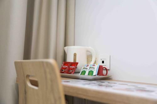 a table with a tray with a coffee mug on it at A Quinta de Cea in Cea