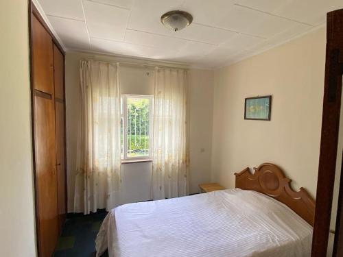 a bedroom with a white bed and a window at 3 Bedroom Villa with Garden in Addis Ababa Bole in Addis Ababa