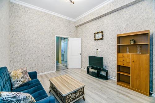 Гостиная зона в Deluxe Apartment 128/34