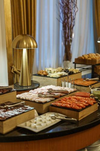 a buffet with many different types of food on a table at Hotel Carlton in Bilbao