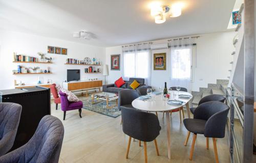 a living room with a table and chairs at Casa Gianni in SantʼAntìoco
