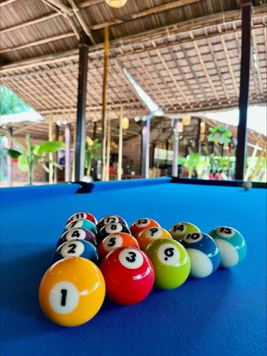 a group of billiard balls on a pool table at ENSO Retreat Hoi An - Rediscovery & Serenity in Hoi An