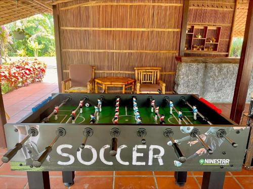 a foosball table with the word soccer on it at ENSO Retreat Hoi An - Rediscovery & Serenity in Hoi An