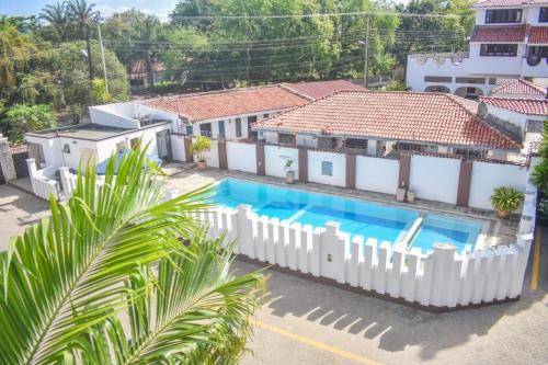 an aerial view of a house with a swimming pool at PALM TERRACE HOMESTAY NYALI - On samaki lane in Mombasa