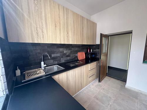 a kitchen with a sink and a counter top at EVN Rooms in Yerevan