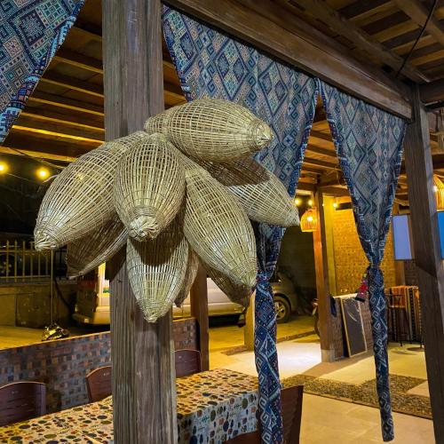 a sculpture of two baskets on a table at Duy Tuyen Ba Be Homestay in Bak Kan