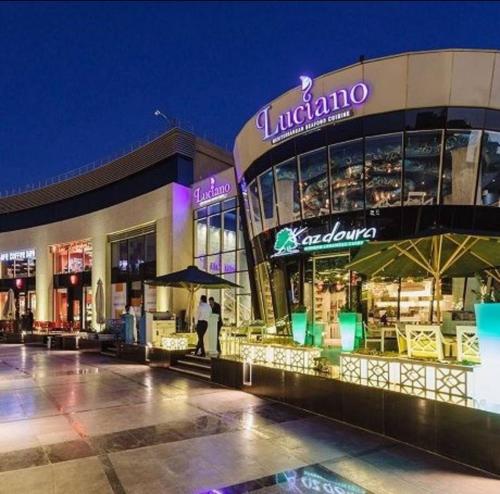 a store front of a shopping mall at night at Elite Boutique Hotel in Cairo