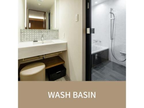 a bathroom with a sink and a toilet and a shower at The OneFive Villa Fukuoka - Vacation STAY 33467v in Fukuoka