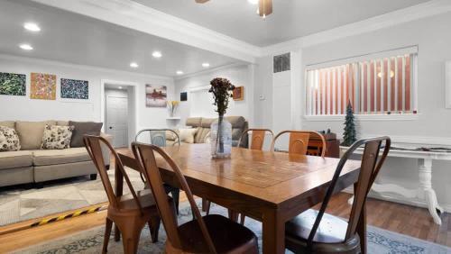 a dining room and living room with a table and chairs at 1880s Victorian Remodel - 1 2 block from downtown in Leadville