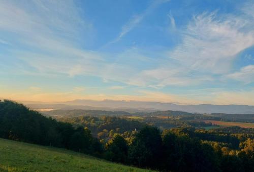a view of a valley from a hill with trees at Ałabajka in Wleń
