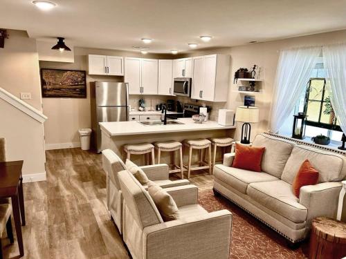 a living room with a couch and a kitchen at Leadville's Copper Top Getaway in Leadville