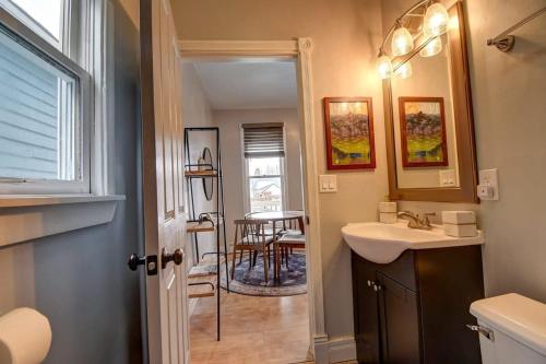 a bathroom with a sink and a mirror and a table at Stylish 1BR Airbnb in Leadville with Mountain Views - Near Skiing - Pets okay in Leadville