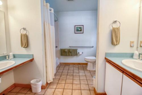 a bathroom with two sinks and a toilet at Lackawanna 1A in Leadville
