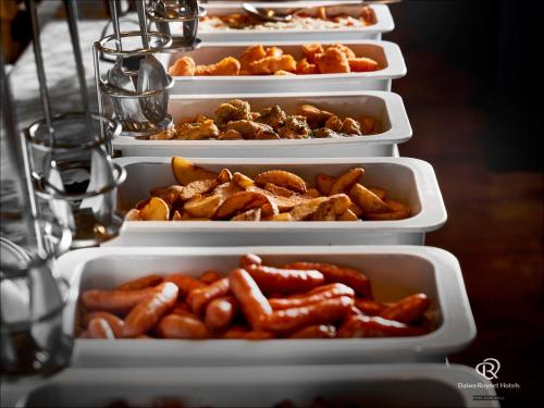 a row of refrigerators filled with hot dogs and other food at Daiwa Roynet Hotel Nishi-Shinjuku PREMIER in Tokyo