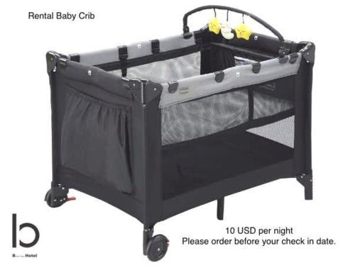 a black metal shopping cart with a black finish at bHOTEL Nekoyard - Modern Loft Studio Near Peace Park & City Center in Hiroshima