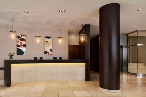 a lobby with a reception desk in a building at NH Tenerife in Santa Cruz de Tenerife